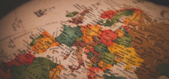 white red and green map by Christian Lue courtesy of Unsplash.